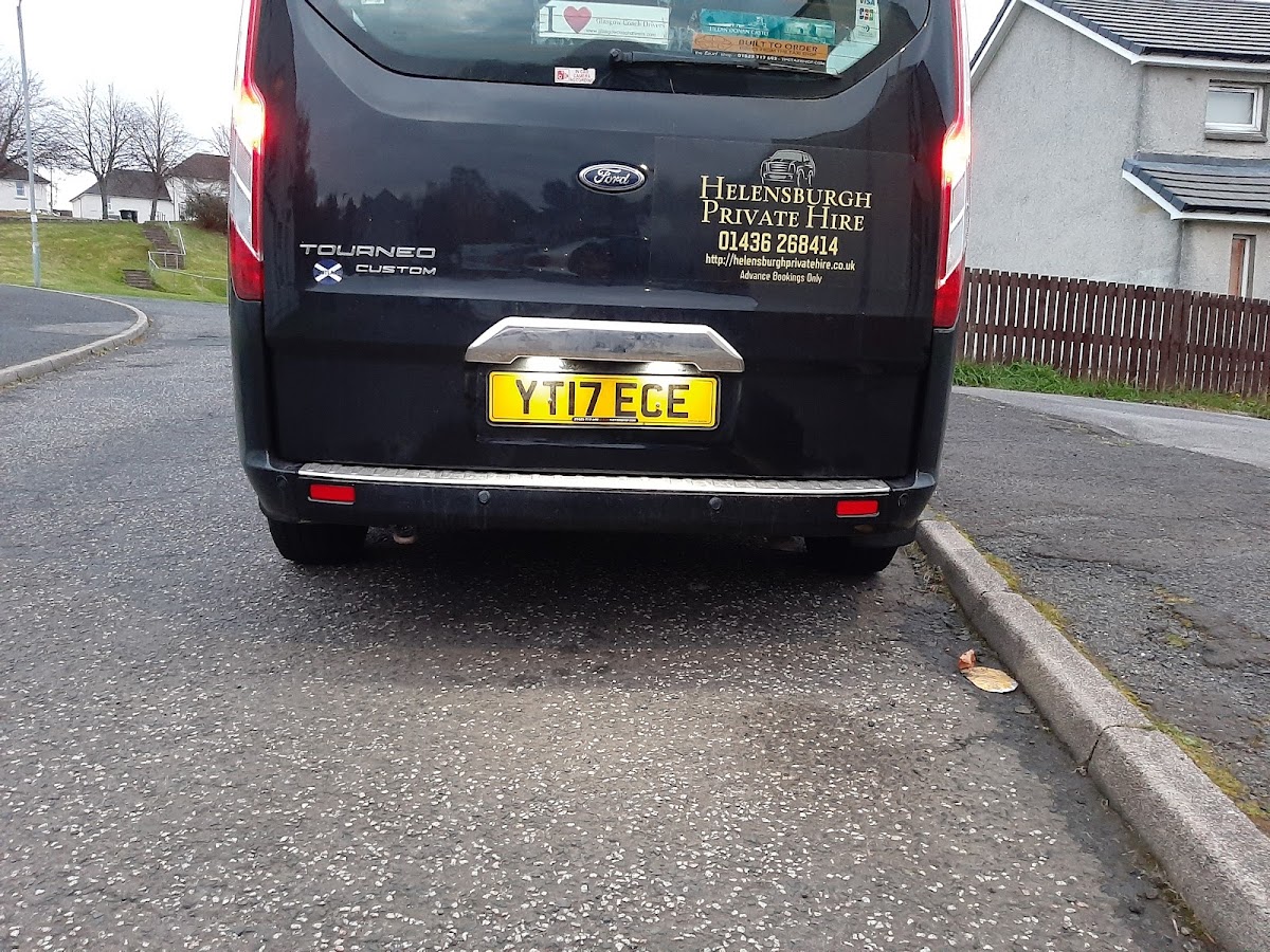 Trident Taxis branded Ford minibus, rear view